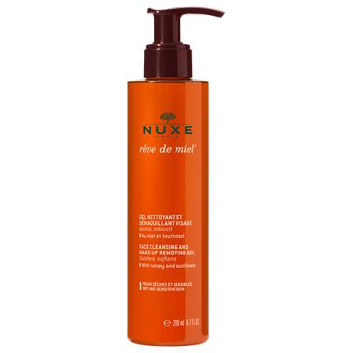 Nuxe Rêve de Miel 200 ml rauhoittava puhdistusgeeli meikinpoistoon oranssissa pullossa tummanruskealla pumpulla.