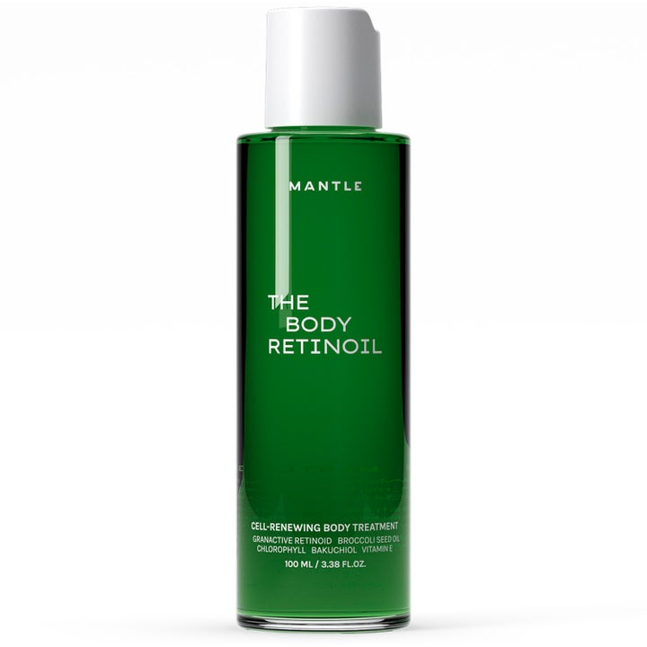 Mantle The Body Retinoil 100 ml uudistava vartaloöljy vihreässä läpinäkyvässä pullossa valkoisella korkilla.