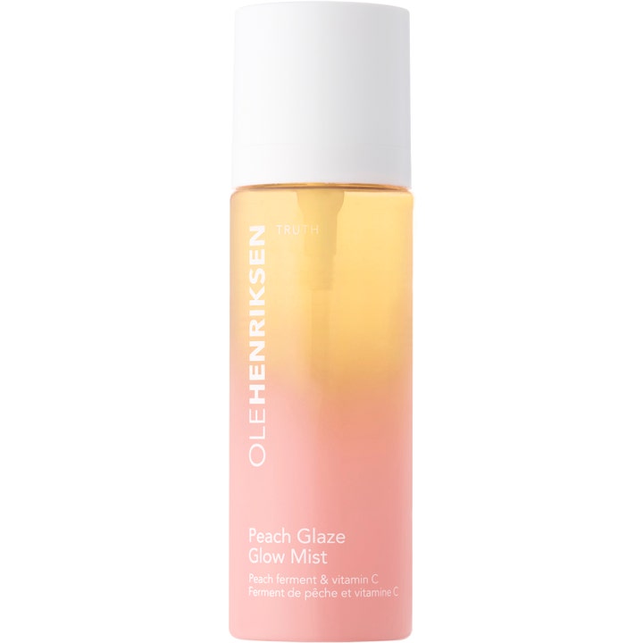 Ole Henriksen Peach Glaze Glow Mist 100 ml heleyttävä kasvosuihke persikanvärisessä pullossa kirkastavalla C-vitamiinilla.