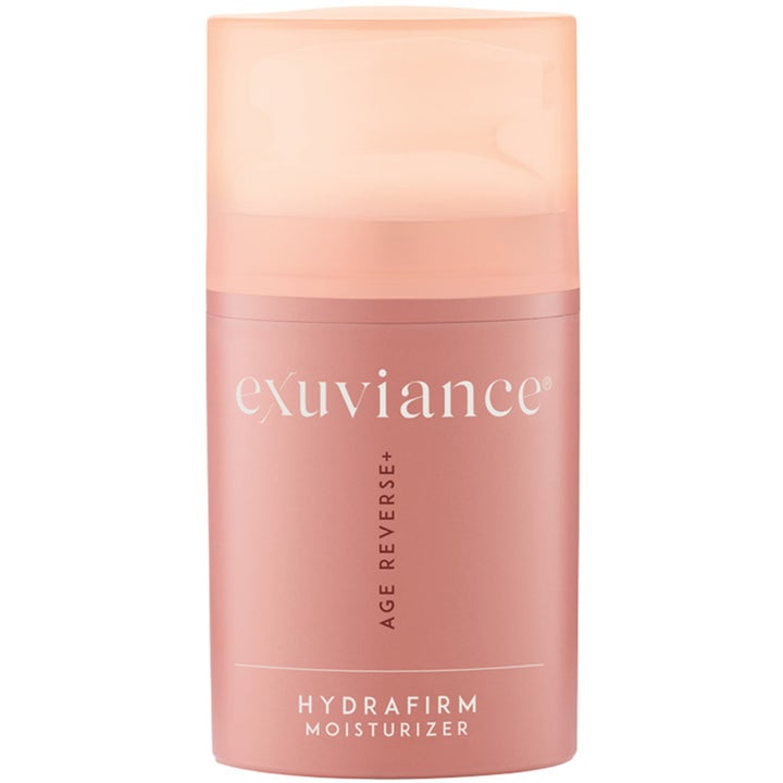 Exuviance Age Reverse+ Hydrafirm Moisturizer 50g kiinteyttävä kasvovoide vaaleanpunaisessa pullossa läpikuultavalla korkilla.