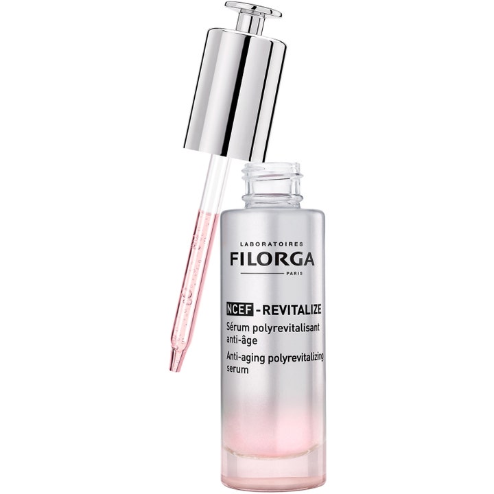 Filorga NCEF-Revitalize Serum 30 ml elvyttÀvÀ anti-age-seerumi hopeisella pipetillÀ ja vaaleanpunaisella koostumuksella.