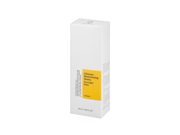COSRX Ultimate Moisturizing Honey Overnight Mask 60 ml kosteuttava yönaamio valkoisessa pahvipakkauksessa.