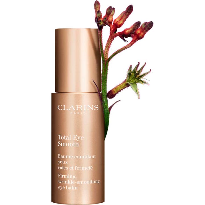 Clarins Total Eye Smooth 15 ml kiinteyttävä silmänympärysvoide ruusukultaisessa pumppupullossa kukan kera