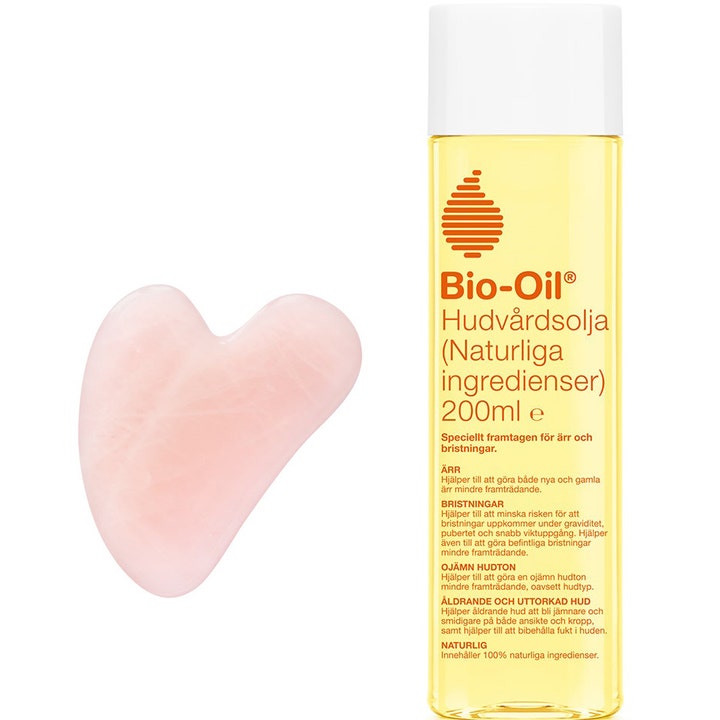 Bio-Oil Ihoöljy 200ml luonnollinen hoito arville keltaisessa pullossa vaaleanpunaisen sydän-gua shan kera.