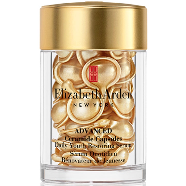 Elizabeth Arden Advanced Ceramide Capsules uudistava kasvoseerumi kultaisina kapseleina kirkkaassa kultakantisessa purkissa.