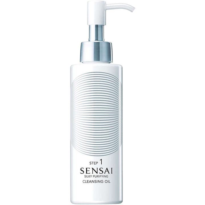 Sensai Silky Purifying Cleansing Oil 150 ml puhdistusöljy valkoisessa pumppupullossa hopeisilla yksityiskohdilla.