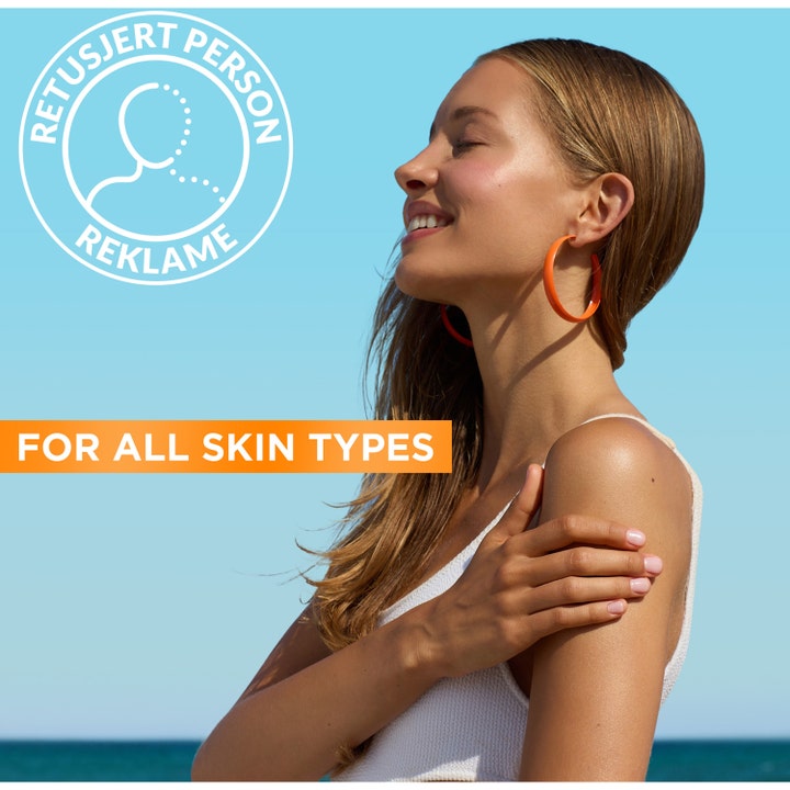 Garnier Ambre Solaire Hydra 24H Protect 175 ml aurinkosuojavoide nainen nauttimassa auringosta kaikille ihotyypeille.