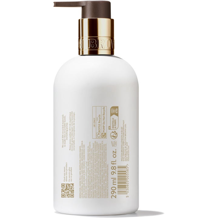 Molton Brown Milk Musk Body Lotion 300 ml kosteuttava vartalovoide valkoisessa pullossa ruskealla pumpulla.