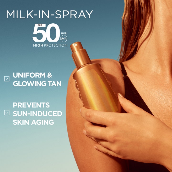Garnier Ambre Solaire Ideal Bronze Milk-in-Spray 150 ml aurinkosuihke SPF 50 antaa iholle tasaisen hehkun.