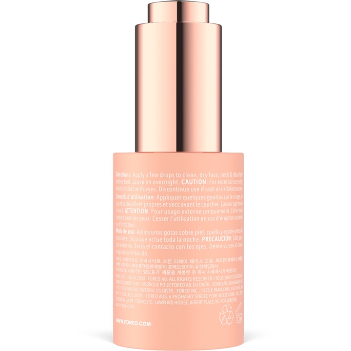 FOREO SUPERCHARGED Overnight Skin Repair Face Oil 30 ml korjaava kasvoöljy persikkaisen pullon kääntöpuolelta kuvattuna.