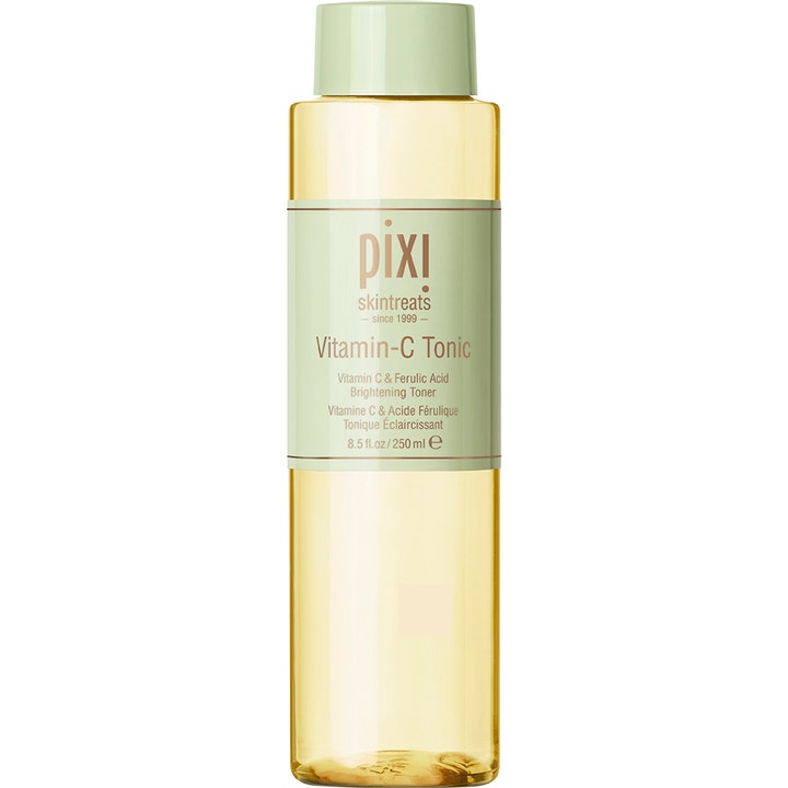 Pixi Vitamin-C Tonic 250 ml kirkastava kasvovesi heleyttää ihoa keltaisessa pullossa vaaleanvihreällä korkilla.