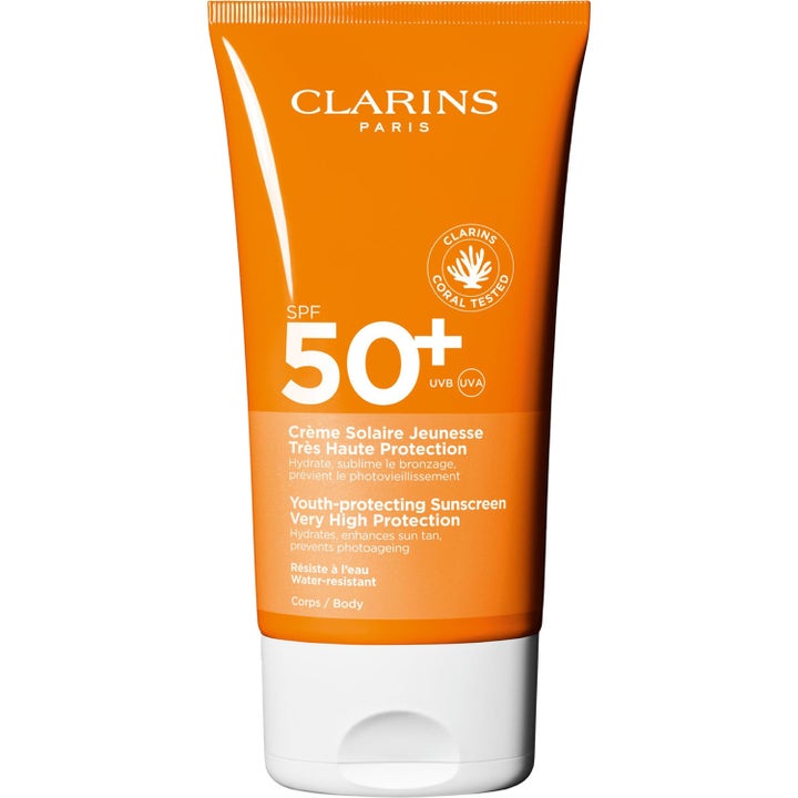 Clarins Sun Care Cream SPF 50+ kosteuttava aurinkovoide oranssissa tuubissa ehkäisee ihon valovanhenemista