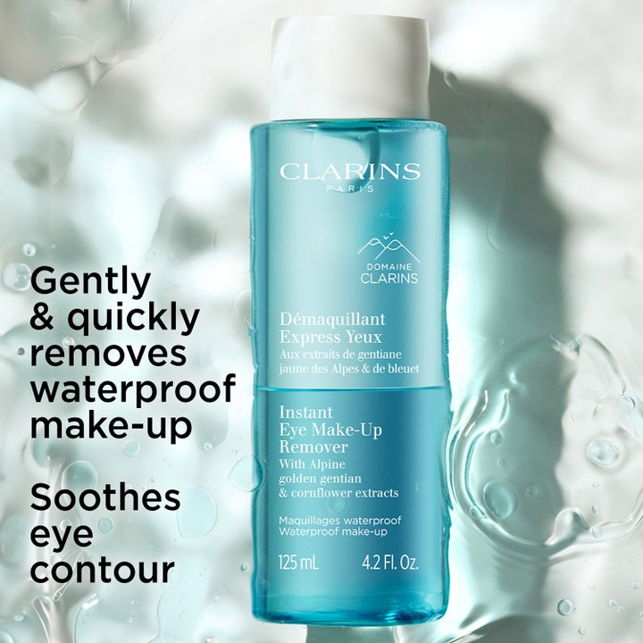 Clarins Instant Eye Make-Up Remover 125 ml rauhoittava silmämeikin poistoaine sinisessä pullossa vesitaustalla.