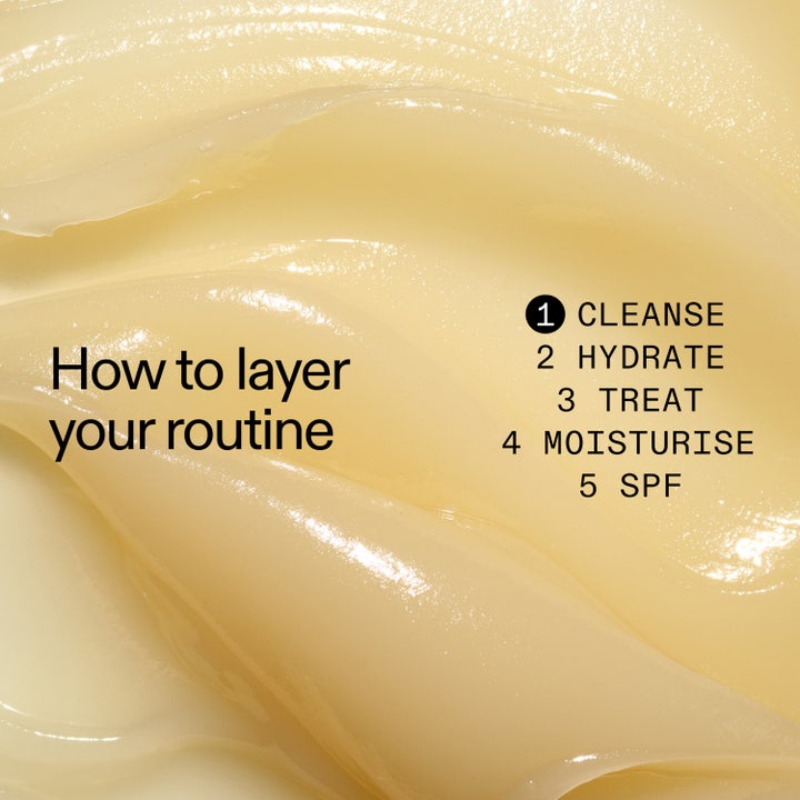 The INKEY List Oat Cleansing Balm 150 ml puhdistusvoide paksulla tekstuurilla ja tekstillä vaiheesta 1 Cleanse.