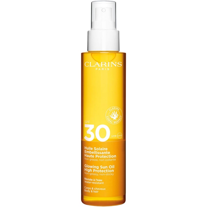 Clarins Glowing Sun Oil SPF 30 150 ml suojaava aurinkoöljy oranssissa läpinäkyvässä suihkepullossa