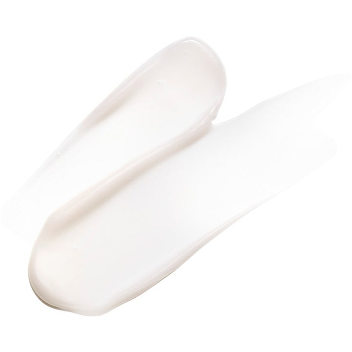 Exuviance Night Corrector 50 g uudistava yövoide, jonka valkoinen ja täyteläinen voidekoostumus levittyy tasaisesti.