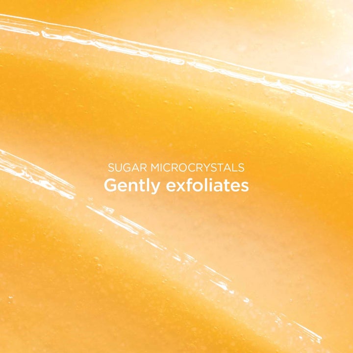 Clarins Comfort Scrub 50 ml ravitseva kuorintageeli, jossa on sokerikiteitä sisältävä keltainen koostumus.