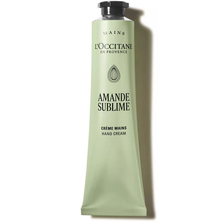 L'Occitane Amande Delicious Hands 75 ml pehmentävä käsi- ja kynsivoide vaaleanvihreässä tuubissa mustalla korkilla.