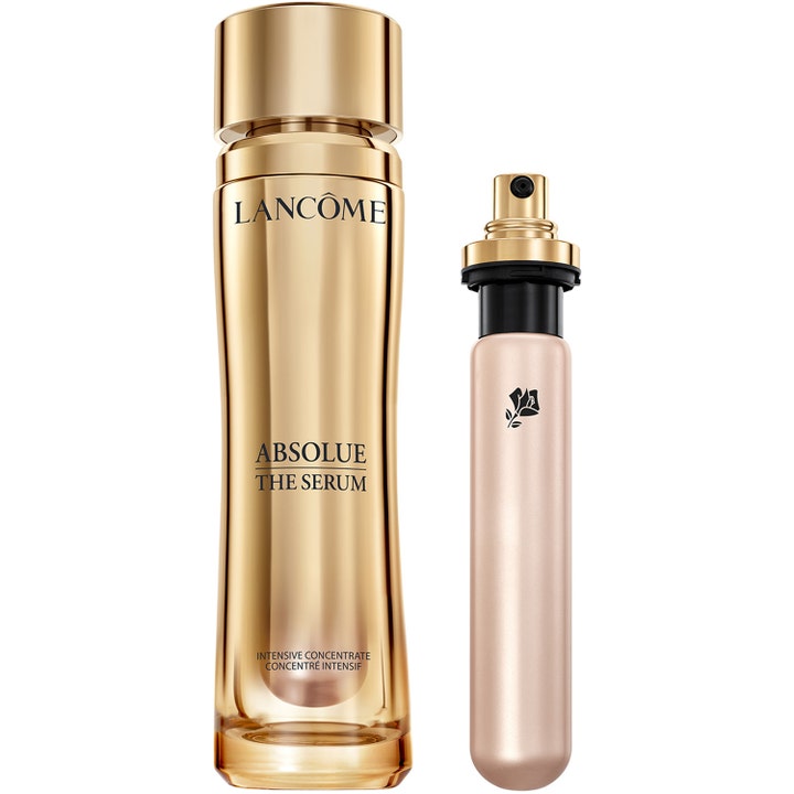 Lancôme Absolue The Serum 30 ml uudistava seerumi kultaisessa metallipullossa sekä kapea täyttöpakkaus pumpulla.