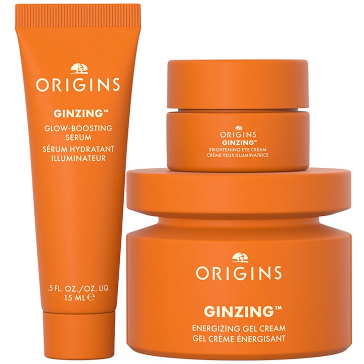 Origins The Glow-Boosting Collection 70 ml ihonhoitosetti oransseissa purkeissa ja tuubissa kirkastaa ihoa.