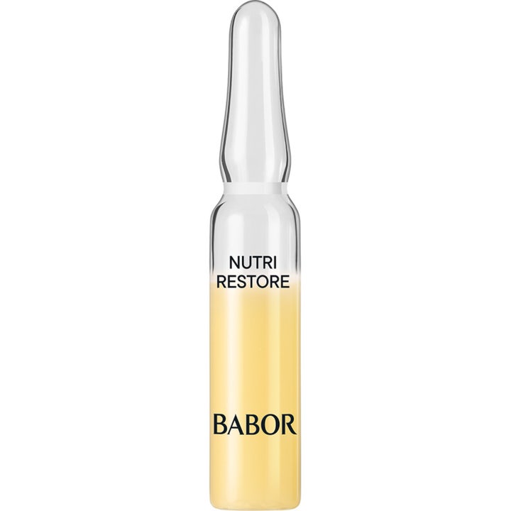 Babor Nutri Restore 2 ml ravitseva seerumiampulli uudistaa ihoa keltaisella hoitonesteellä kirkkaassa lasissa