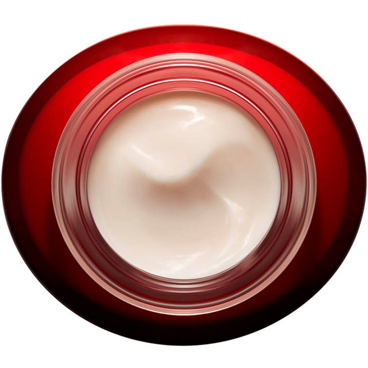 Clarins Super Restorative Day Cream 50 ml uudistava päivävoide punaisessa purkissa, jossa on vaaleanpunainen voide.