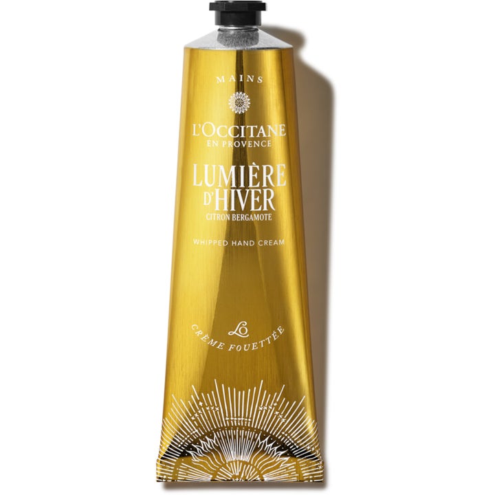 L'Occitane Lumière d'Hiver 150 ml ravitseva käsivoide kiiltävässä kultaisessa tuubissa.