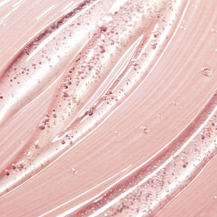 Nuxe Prodigieux Floral Shower Gel 200 ml puhdistava suihkugeeli, jossa on vaaleanpunainen ja ilmakuplia sisältävä koostumus.