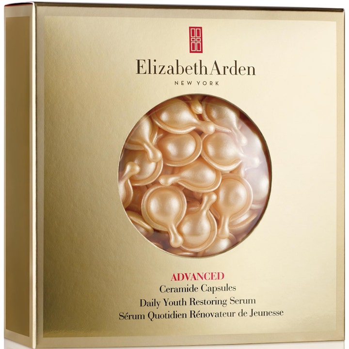 Elizabeth Arden Advanced Ceramide Capsules nuorentava kasvoseerumi kultaisessa rasiassa täynnä hohtavia kapseleita.