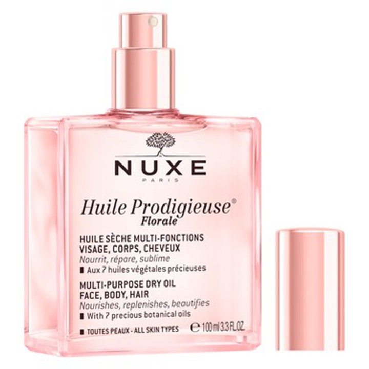 Nuxe Huile Prodigieuse Florale 100 ml monikäyttöinen kuivaöljy ravitsee ihoa ja hiuksia vaaleanpunaisessa lasipullossa.
