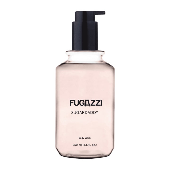 Fugazzi Sugardaddy 250 ml puhdistava suihkugeeli läpinäkyvässä pullossa, jossa on vaaleanpunainen neste ja musta pumppu.