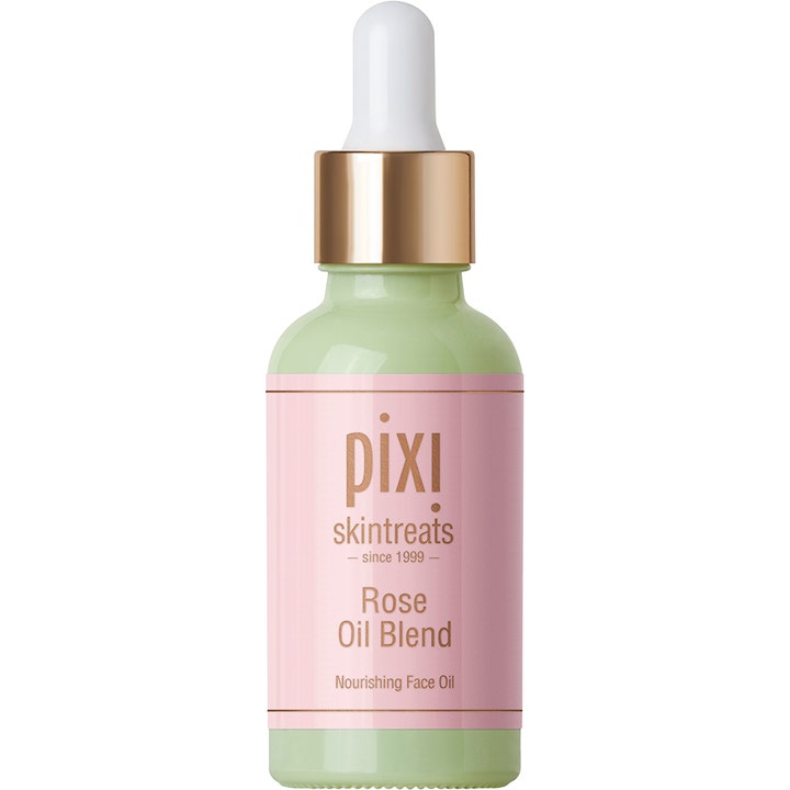 Pixi Rose Oil Blend 30 ml ravitseva kasvoöljy vihreässä lasipullossa, jossa on vaaleanpunainen etiketti ja kultainen pipetti.