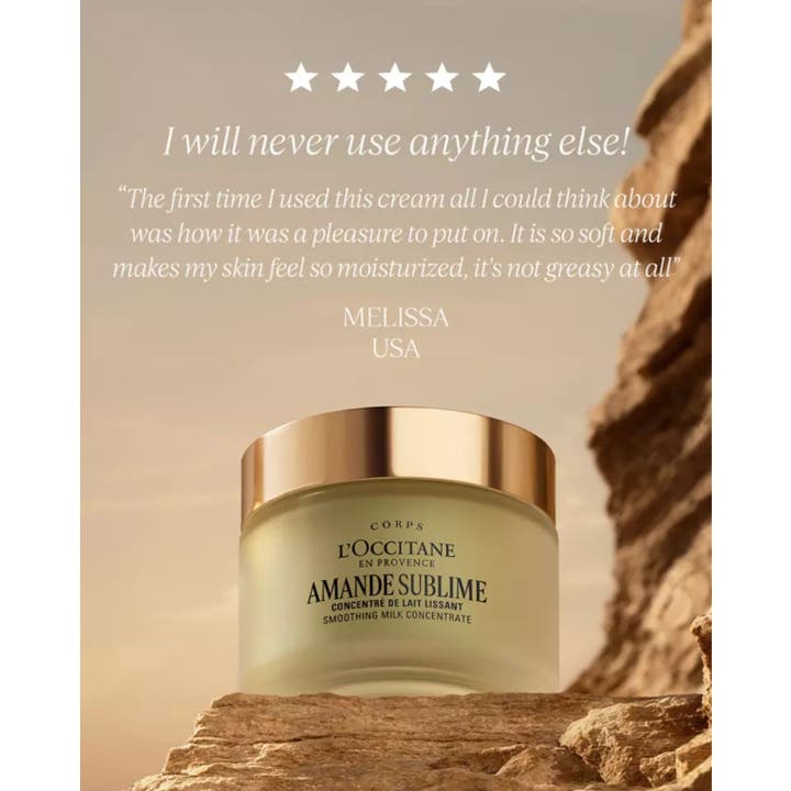 L'Occitane en Provence Almond Milk Concentrate 200 ml silottava vartalovoide kultakantisessa lasipurkissa kivellä