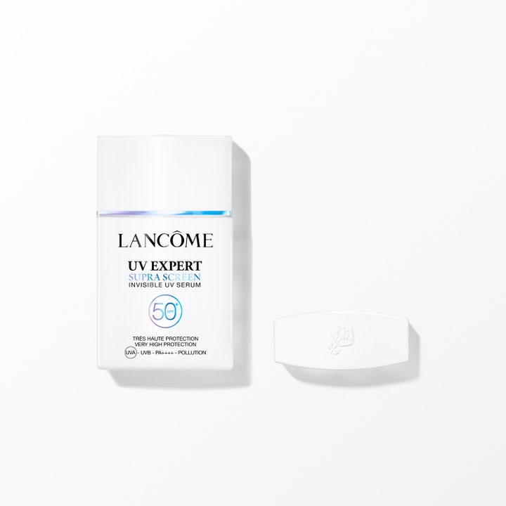 Lancôme UV Expert Supra Screen SPF 50+ aurinkoseerumi on suojaava tuote valkoisessa pullossa, jossa on irrallinen korkki.