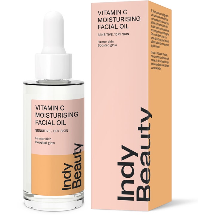 Indy Beauty Vitamin C Moisturising Facial Oil 30 ml hehkua antava kasvoöljy pipettipullossa ja persikanvärisessä pakkauksessa.