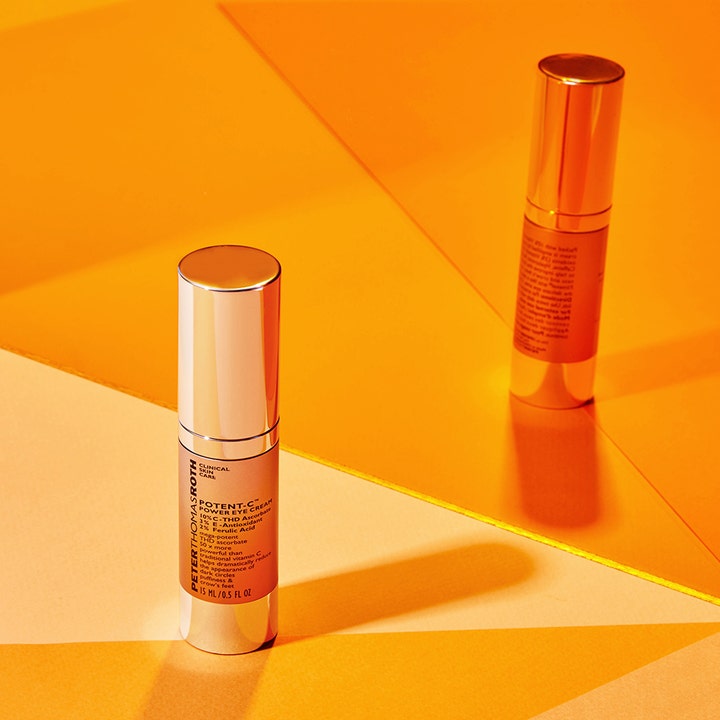 Peter Thomas Roth Potent C Eye Cream 15 ml C-vitamiini silmänympärysvoide hopeisessa pullossa oranssilla taustalla.