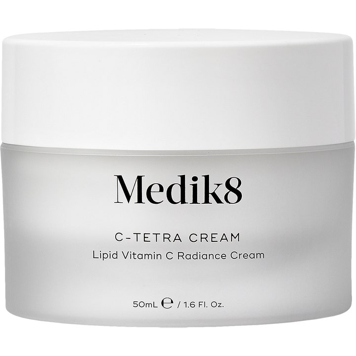 Kirkastava Medik8 C-Tetra Cream 50 ml C-vitamiinivoide huurteisessa lasipurkissa valkoisella korkilla.