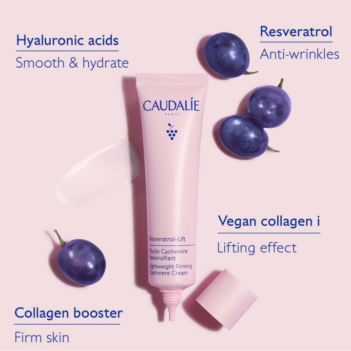 Caudalie Resveratrol-Lift 40 ml kiinteyttävä kasvovoide vaaleanpunaisessa tuubissa rypäleiden ja kollageenitekstien kera.