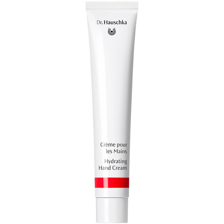 Dr. Hauschka Hydrating Hand Cream 50 ml ravitseva käsivoide valkoisessa tuubissa punaisella raidalla.
