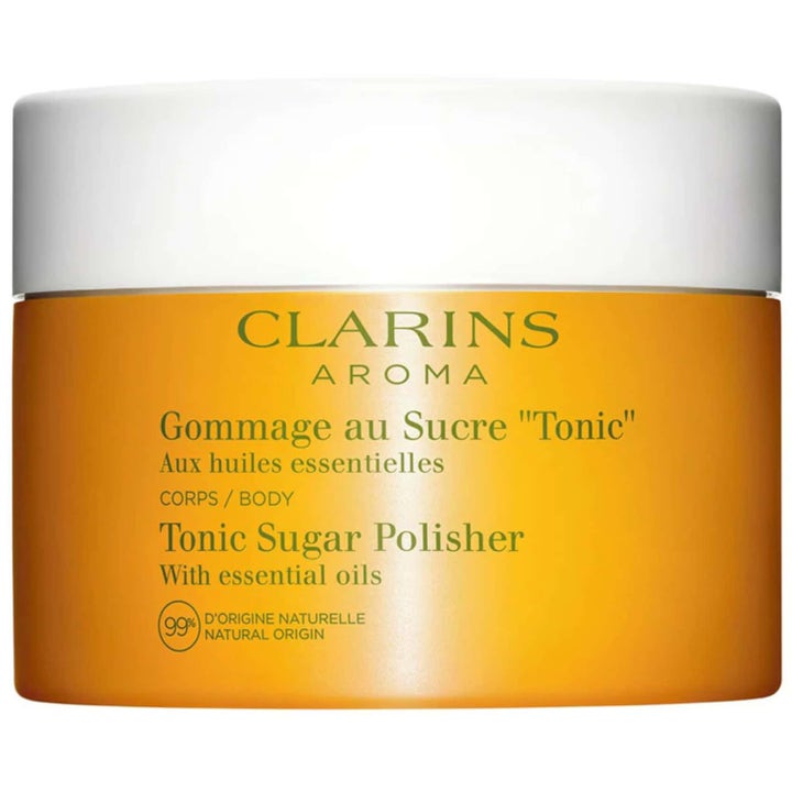 Clarins Tonic Sugar Polisher vartalonkuorinta kirkastaa ihoa eteerisillä öljyillä oranssissa purkissa