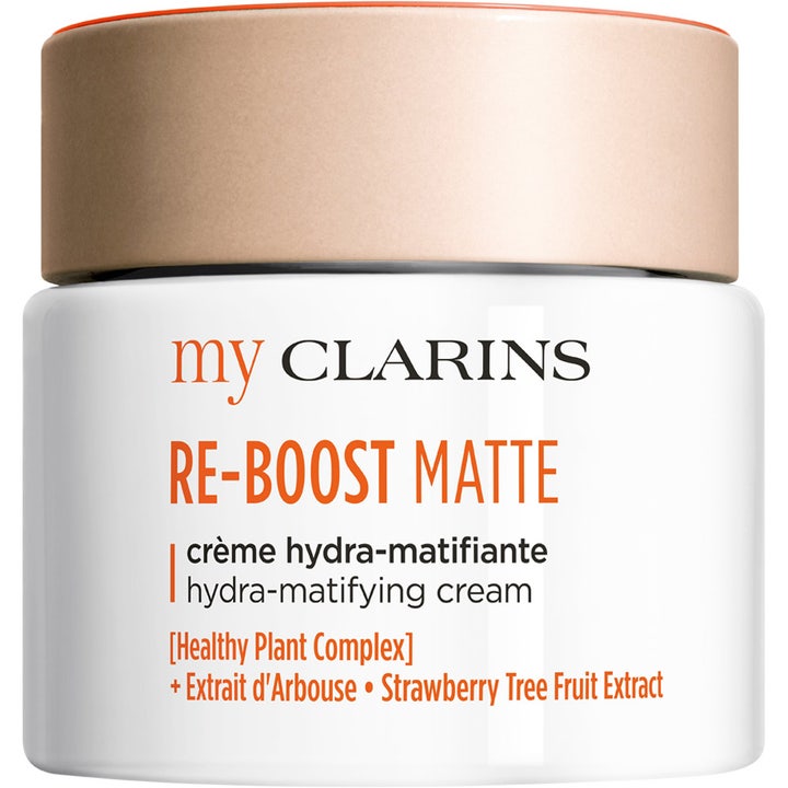 My Clarins RE-BOOST MATTE mattaava kasvovoide hillitsee kiiltoa valkoisessa purkissa persikanvärisellä kannella.