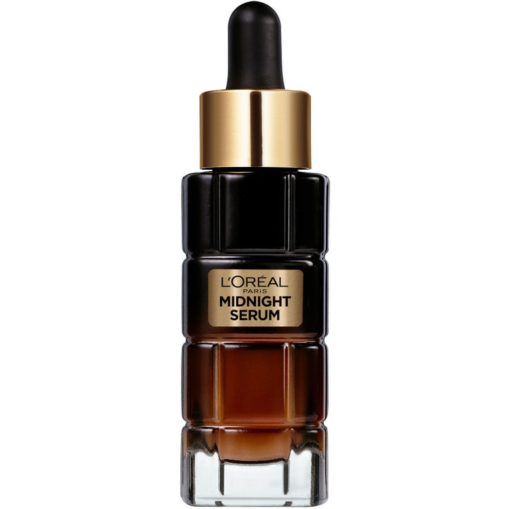 L'Oréal Paris Midnight Serum uudistava yöseerumi tummassa särmikkäässä lasipullossa, jossa on kultainen korkki ja pipetti.