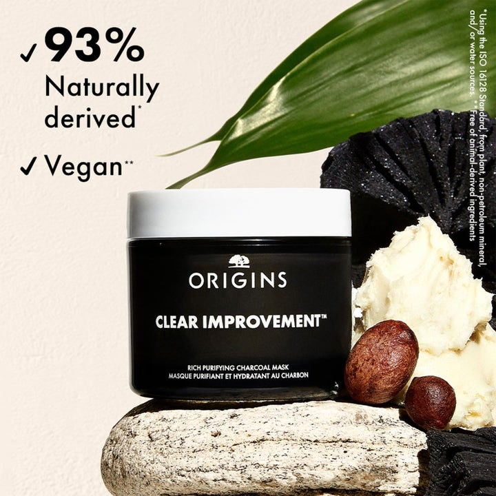 Origins Mask Masters 105 ml syväpuhdistava vegaaninen hiilinaamio mustassa purkissa hiilen ja karitevoin kera.