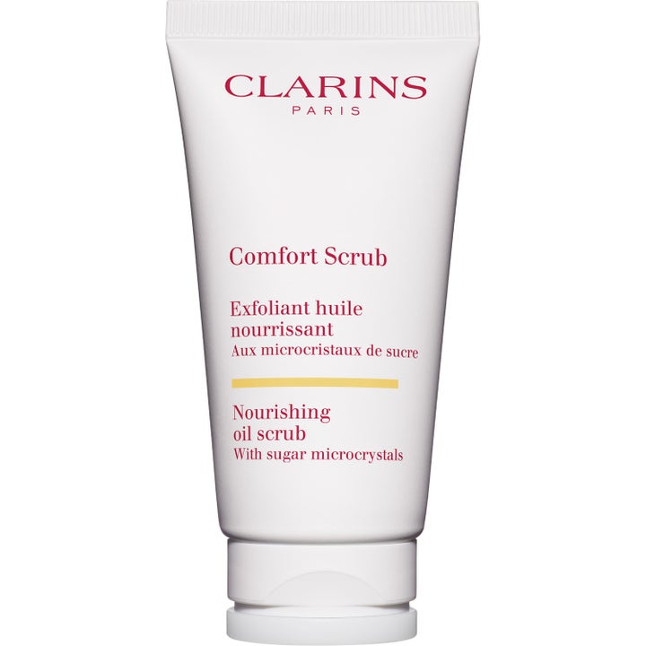 Clarins Comfort Scrub 50 ml ravitseva kuorintavoide valkoisessa tuubissa sokerikiteillä.