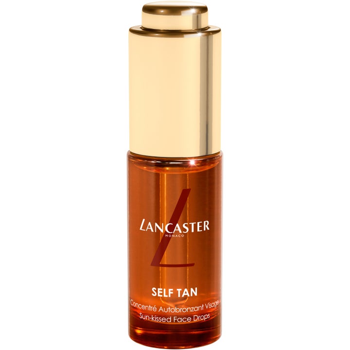 Lancaster Self Tan Sun-kissed Face Drops hehkua antavat itseruskettavat tipat meripihkanvärisessä lasipullossa kultakorkilla.