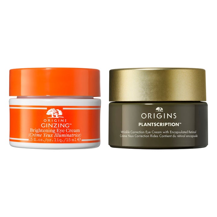 Origins GinZing ja Plantscription 15 ml kirkastavat ja silottavat silmänympärysvoiteet oranssissa ja vihreässä purkissa.