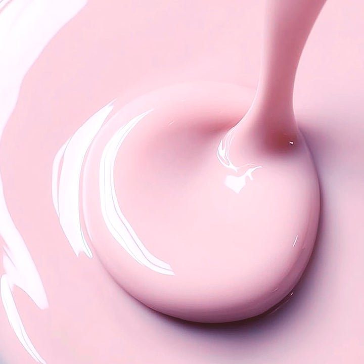 MANTLE The Miracle Fluid 250 ml silkkisen pehmeä seerumi, jossa on vaaleanpunainen kermainen koostumus