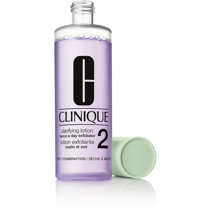 Clinique Clarifying Lotion 2 450ml kuoriva kasvovesi kirkastaa ihoa lila neste pullossa ja vihreä korkki.