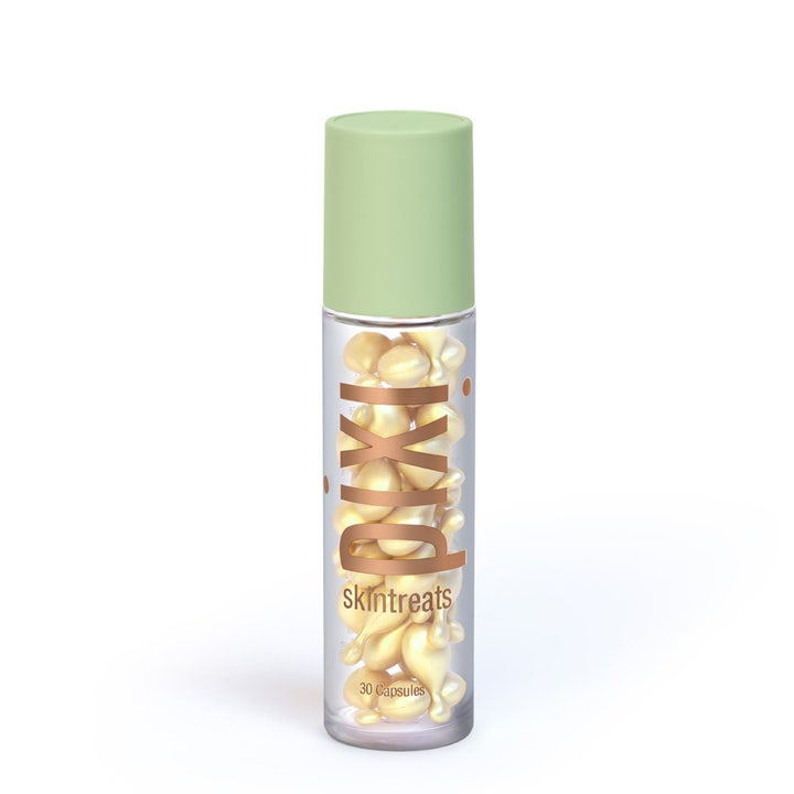 Pixi Skintreats 30 kpl heleyttävä seerumi läpinäkyvässä pakkauksessa, jossa on keltaisia kapseleita ja vihreä korkki.