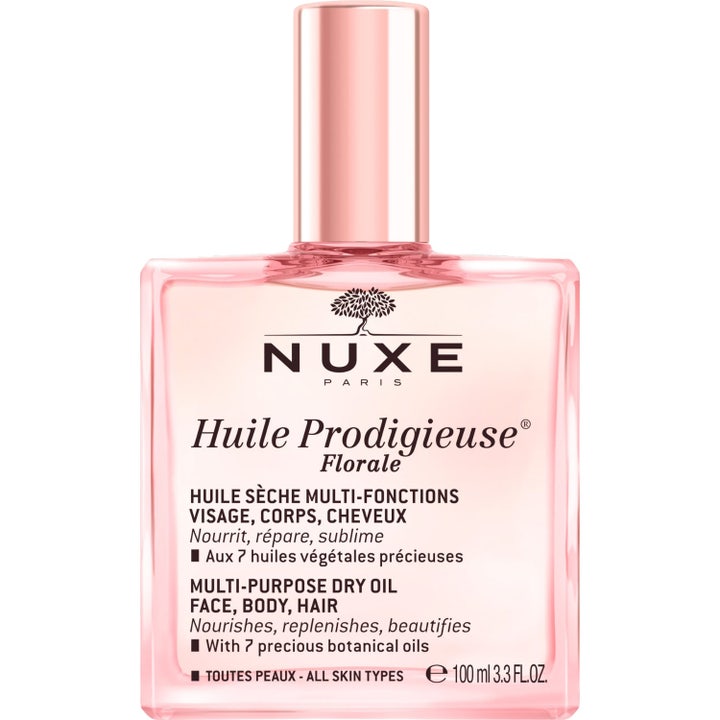 Nuxe Huile Prodigieuse Florale 100 ml monikäyttöinen kuivaöljy ravitsee ihoa ja hiuksia vaaleanpunaisessa lasipullossa.